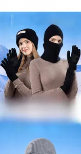 Detail view of winter balaclava mask and touchscreen gloves with thermal knit fabric