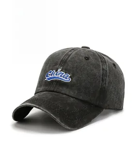Detailed view of the washed cotton fabric and China embroidery on the gray baseball cap