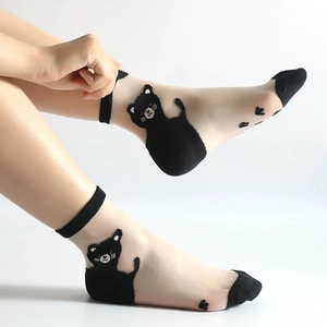 Close-up of sheer crystal socks featuring cute black cat pattern and reinforced toe