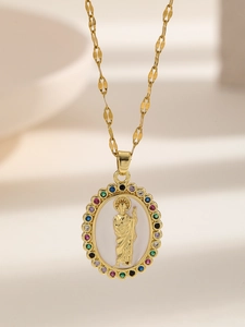Macro shot of Virgin Mary pendant with colorful pavé cubic zirconia and gold chain