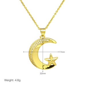 Macro detail of gold-plated moon and star pendant with dimensions 22mm by 17mm