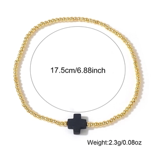 Bracciale elastico con perline dorate e croce nera, misura 17,5 cm e peso 2,3 g