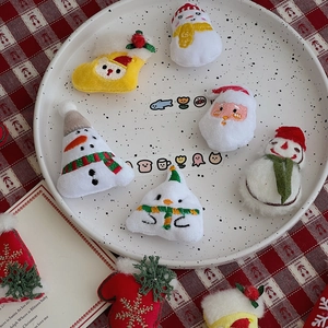 Detailed view of plush Christmas embroidery patches featuring Snowman and Santa Claus