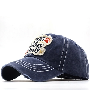 Distressed dark blue cotton baseball cap featuring DOG Vibes Only patch and frayed edges