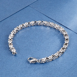 Vintage silver flower link bracelet in woven stainless steel with a secure lobster clasp