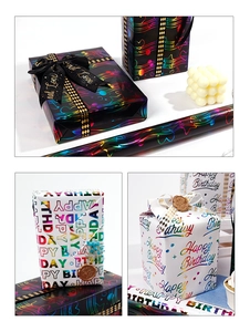 Macro view of laser laser-gold birthday wrapping paper with musical notes and black ribbon