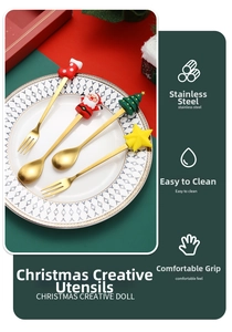 Close-up of golden stainless steel Christmas cutlery set with cute cartoon doll charms