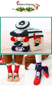 Close-up of thick Christmas socks with festive patterns and elastic ribbed cuffs