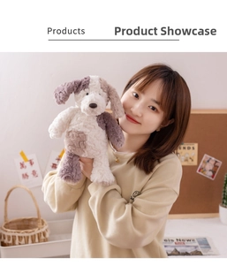 Detail of plush long-eared dog toy held by a model showing soft texture and size
