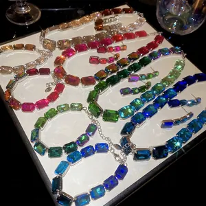 Sparkling crystal jewelry set featuring colorful rectangular pendants on silver chains