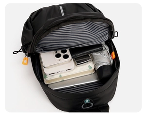 Interior view of black nylon chest bag showing large capacity for tablet and umbrella