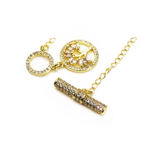 Macro detail of gold tree of life toggle clasp with micro-set zircon stones for DIY jewelry