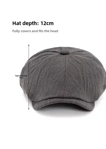 Detail shot of 12cm depth measurement on a dark grey herringbone newsboy hat