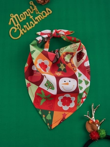 Detailed view of festive Christmas pet bandanas with snowman and tree patterns
