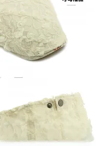 Detail of adjustable metal buckle and lace floral texture on beige summer mesh cap