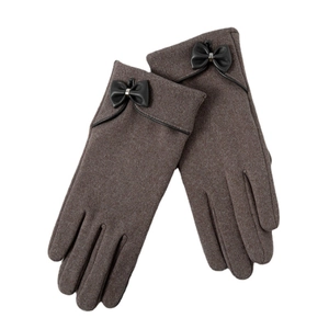 Elegant dark brown thermal knit gloves with a black leather bow decoration on white background