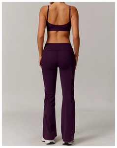 Rear view of deep purple yoga set with U-shaped sports bra and flare fitness leggings