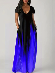Detail of V-neckline and functional side pockets on a gradient blue maxi dress