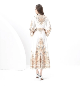 Detail of vintage baroque print on the back and waist of a white A-line maxi dress