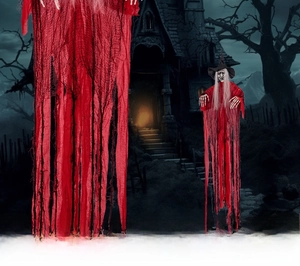 Detail of red hanging witch ghost with skeleton hands and ragged fabric for Halloween