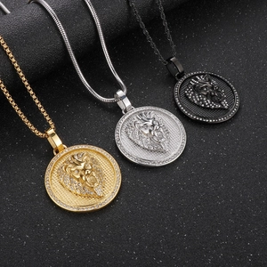 Detailed view of hip hop lion head pendants in gold, silver, and black with zircon inlays