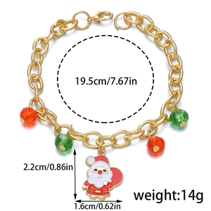 Golden Christmas bracelet with red and green beads featuring a Santa Claus charm pendant