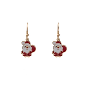 Detail of Christmas Santa Claus drop earrings featuring red and white enamel on gold alloy