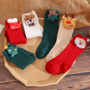 Festive Christmas socks for kids with 3D cartoon reindeer and Santa motifs in knit cotton