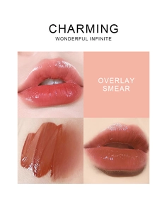Macro detail of mirror finish water-gloss lip glaze showing coral red shade and overlay texture