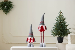 Detail of Christmas gnomes with retractable legs and reindeer knit hats for decor