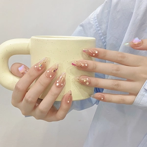 Handmade mermaid press-on nails with pink gradient, glitter, and aurora butterfly charms