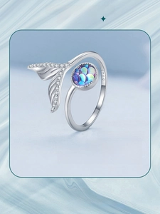 Macro shot of S925 sterling silver mermaid tail ring with shimmering scales and crystals