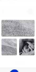 Close-up of gray knitted fabric texture showing dense stitching and premium thermal material