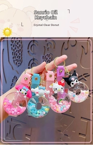 Detailed close-up of acrylic oil-filled donut keychains with cute cartoon characters