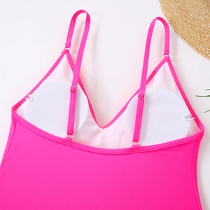 Detail of rose pink swimsuit featuring adjustable thin straps and removable cup pads