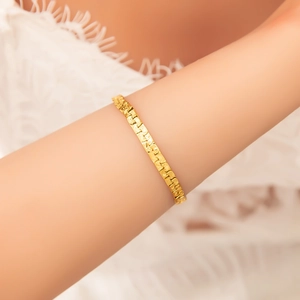 Elegant 18k gold-plated stainless steel bracelet with unique hammered texture on wrist