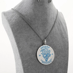 Detail view of punk titanium steel necklace with blue engraved motorcycle pendant