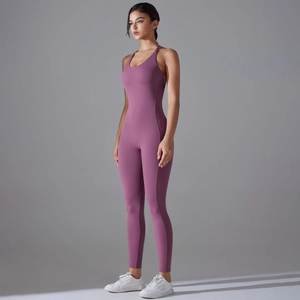 Close-up of purple one-piece yoga jumpsuit featuring a cross back and seamless design