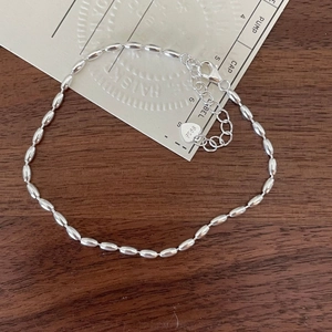 Minimalist S925 sterling silver olive bead bracelet with adjustable heart charm closure