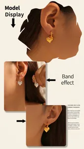 Close-up of hammered gold and silver heart earrings shown on a model for display
