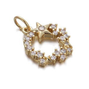 Macro view of gold five-pointed star pendant with sparkling zircon circular halo