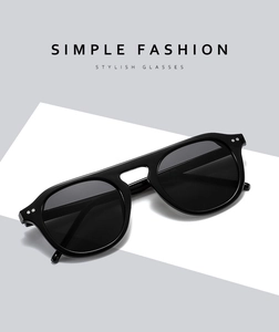 Detail view of retro pilot sunglasses in black frames with polished finish and UV lenses