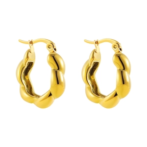 Polished gold chunky hollow hoop earrings with textured wavy surface and mirror finish