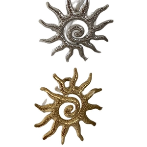 Textured gold and silver sun-shaped open rings with hammered metal finish and spiral design