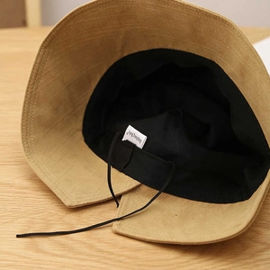 Khaki bucket hat for sun protection with internal adjustable drawstring and black lining