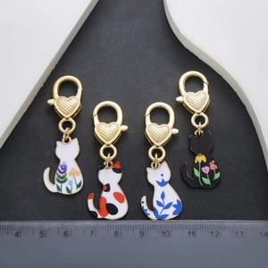 Set of four cartoon cat enamel charms with decorative heart shaped lobster clasps