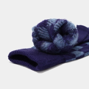 Close-up of thick purple and blue checkered knit fabric with soft mohair texture