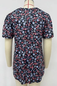 Detail view of floral print on black T-shirt back showing fine fabric texture and patterns