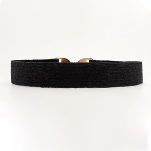 Detail of black woven elastic waist belt with a polished gold geometric metal buckle