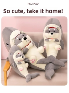 Three sizes of shark husky plush pillows displayed on a cozy sofa for home decoration